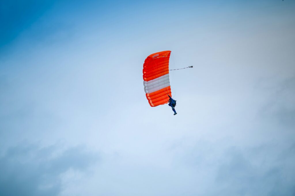 sky diver with parachute open