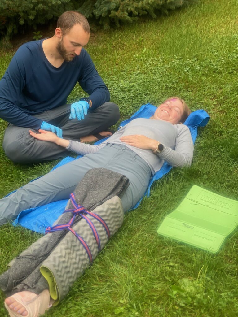 Jake tending to mock patient Emmali with a tib-fib break