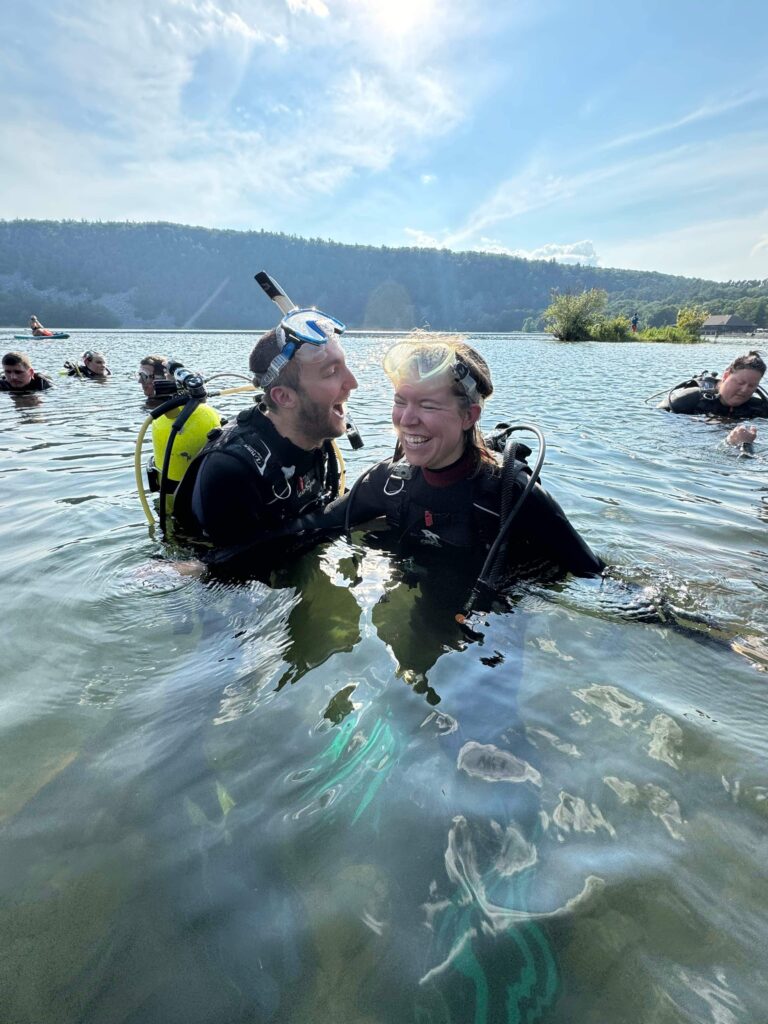 Jake laughing at something in the water getting ready for a dive